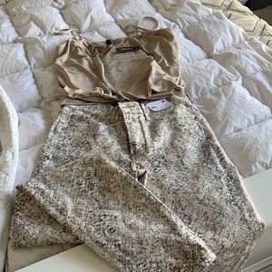 Express tank top & snake print jeans.